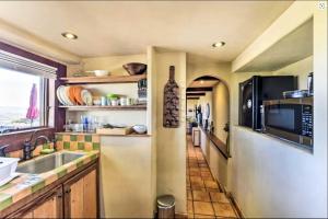 a kitchen with a sink and a microwave at Hacienda - Private Guest Studio in Los Gatos