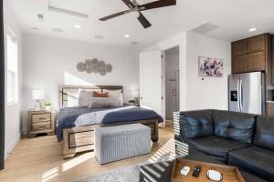 a bedroom with a bed and a living room with a couch at Casa De Luz Casita condo in St. George