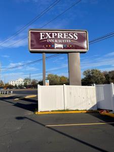 a sign for an express inn and suites on a street at Express Inn-Rahway in Rahway