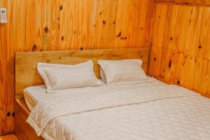 Postel nebo postele na pokoji v ubytování Dak Nguyen Homestay DakLak