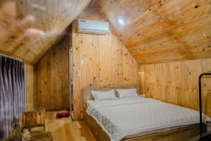 Postel nebo postele na pokoji v ubytování Dak Nguyen Homestay DakLak