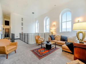 a living room with a couch and chairs and a table at East View House in Middleton in Teesdale