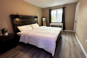 a bedroom with a large bed and a window at No available not in Welland