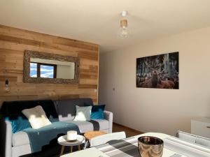 a living room with a couch and a table at Appartement Le Grand-Bornand, 1 pièce, 4 personnes - FR-1-467-91 in Le Grand-Bornand