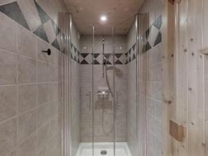 a shower with a glass door in a bathroom at Chalet Le Grand-Bornand, 6 pièces, 11 personnes - FR-1-467-58 in Le Grand-Bornand