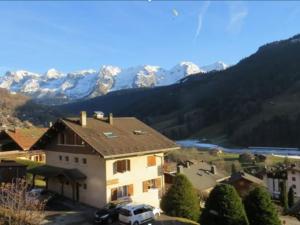 a house with a view of a mountain at Appartement Le Grand-Bornand, 2 pièces, 4 personnes - FR-1-467-75 in Le Grand-Bornand