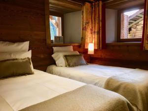 Posteľ alebo postele v izbe v ubytovaní Appartement cosy pour 6 personnes avec parking au Grand-Bornand - FR-1-467-84