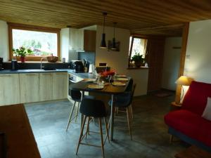 a kitchen with a table and chairs in a room at Appartement Le Grand-Bornand, 2 pièces, 6 personnes - FR-1-467-96 in Le Grand-Bornand