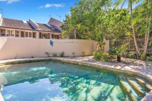 a swimming pool in the backyard of a house at A Perfect Stay - 4 James Cook Apartments in Byron Bay