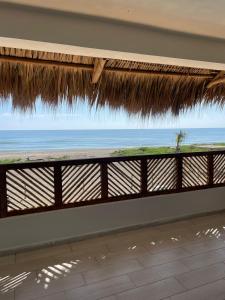 a view of the ocean from a beach house at Boca de agua Villas in Nautla