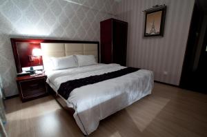 Postel nebo postele na pokoji v ubytování Pariss Hotel