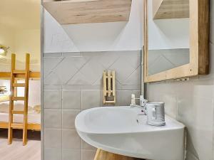 a bathroom with a white sink in a room at Studio Tignes, 1 pièce, 4 personnes - FR-1-411-905 in Tignes