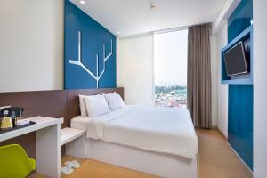 Letto o letti in una camera di 1O1 URBAN Jakarta Pemuda