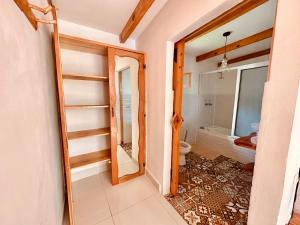a bathroom with a shower and a toilet in it at Sababa Resort in San Pedro La Laguna