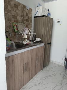 Kuchyň nebo kuchyňský kout v ubytování Apartamento girardot