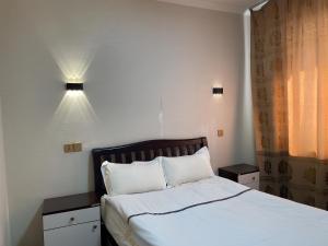 Un pat sau paturi într-o cameră la Khan Hotel Ulaanbaatar