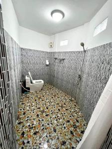 a bathroom with a floor made out of fish tiles at M'pay Bay Guesthouse in Koh Rong Sanloem