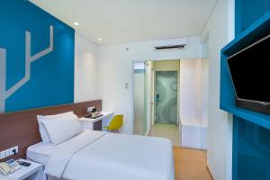 Letto o letti in una camera di 1O1 URBAN Jakarta Pemuda