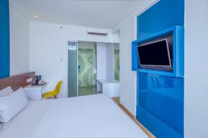 Letto o letti in una camera di 1O1 URBAN Jakarta Pemuda