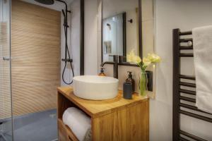 a bathroom with a white sink and a shower at Chalet Manoe - OVO Network in Manigod