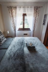 Postel nebo postele na pokoji v ubytování Vila Viktória - Apartmán Viktória 2