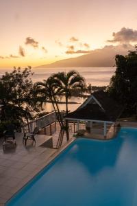 a swimming pool with a view of the ocean at Toahotu estate one of a kind villa in Tahiti Iti pool and view - 15 pers in Vairao