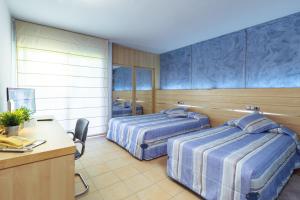 Posteľ alebo postele v izbe v ubytovaní Hotel Sausa