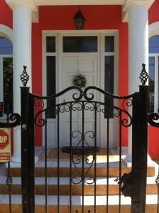 a wrought iron gate in front of a house at Villa Favorita in Eforie Sud