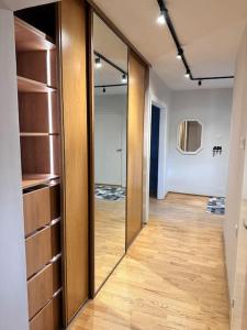 a hallway with a sliding glass door in a room at Only 5 min. From Tallinn Airport in Petrikyula