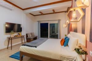 a bedroom with a large bed and a balcony at Seclude Kasauli, Himachal Pradesh in Kasauli