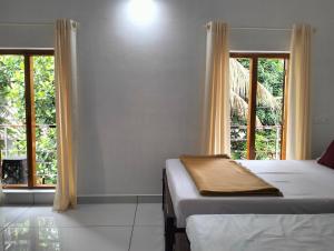 Guestland Homestay客房内的一张或多张床位