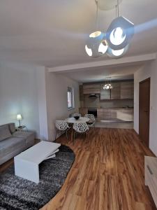 a living room with a couch and a table at LoLa5 in Novi Grad