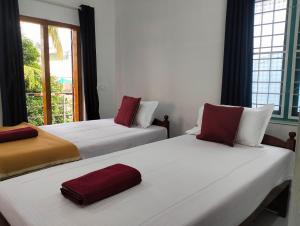 Guestland Homestay客房内的一张或多张床位