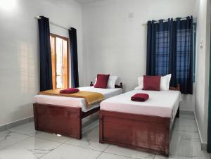 Guestland Homestay客房内的一张或多张床位