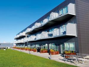 a building with balconies on the side of it at athome apartments in Aarhus