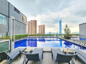 a swimming pool on the roof of a building at 1 min walk to Lot 10 - Pavilion - Fahrenheit for 1-5px in Kuala Lumpur