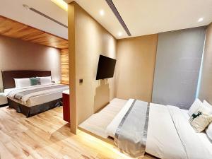 Rúm í herbergi á Vasty Jiaoxi Hotel