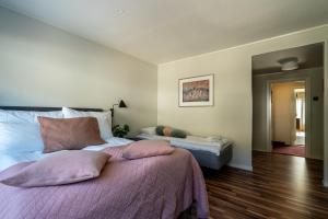 Postel nebo postele na pokoji v ubytování Bardufoss Hotell