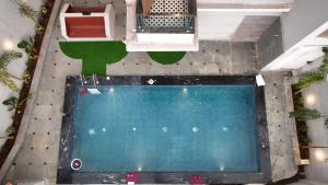 an overhead view of a swimming pool in a house at Euphoria Luxury Villa - 5BHK - Private Pool - Jacuzzi, Baga in Baga
