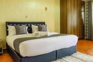 Ένα ή περισσότερα κρεβάτια σε δωμάτιο στο Taliah Homestays