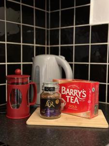 a jar of jam and a box of tea on a counter at Terrace Apartment X91 RR04 in Waterford