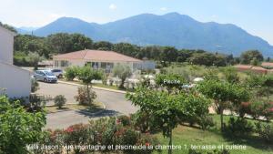 a view of a house with mountains in the background at Jason in Cervione