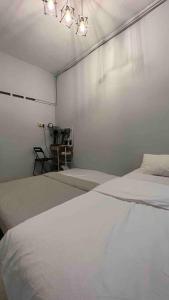 Katil atau katil-katil dalam bilik di 311 Nana’s Homes BBQ, Games, Netflix 11pax