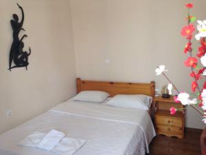 Postel nebo postele na pokoji v ubytování Rethymno House