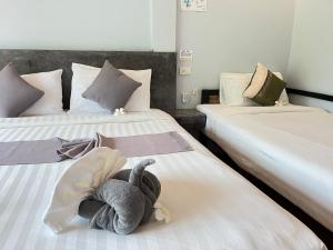Letto o letti in una camera di Baan Check In
