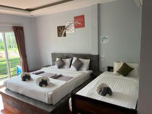 Letto o letti in una camera di Baan Check In
