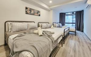 Ένα ή περισσότερα κρεβάτια σε δωμάτιο στο 16pax Bukit Bintang Pavilion/Fahrenheit/ Netflix