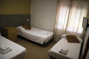 Posteľ alebo postele v izbe v ubytovaní Hostal Valdepeñas by Bossh! Hotels