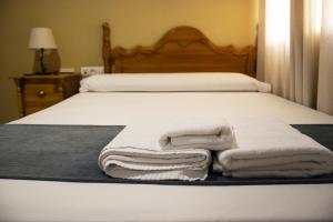 Posteľ alebo postele v izbe v ubytovaní Hostal Valdepeñas by Bossh! Hotels