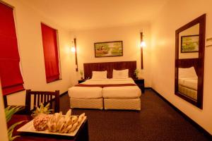 Rúm í herbergi á Hotel Nippon Colombo